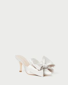 Shop the Margot Cream Satin Bow Mule at Loefflerrandall.com Bow Wedding Details, Pointed Wedding Shoes, Hoco Accessories, Wedding Mules, White Bow Heels, Elopement Dinner, Hoco Shoes, Italian Elopement, Bridal Closet