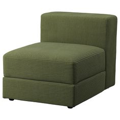 a green chair sitting on top of a white floor