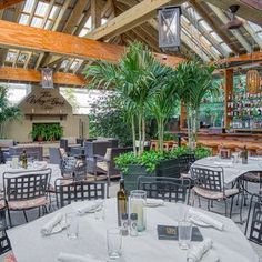 the inside of a restaurant with tables and chairs