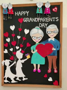 an old couple holding a heart in front of a blackboard with the words happy grandparents day written on it