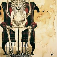 a skeleton sitting on top of a red chair next to a woman in a white dress