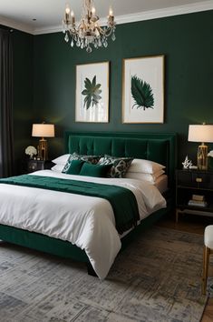 a bedroom with green walls, white bedding and chandelier hanging from the ceiling