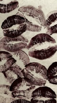 a bunch of black and white lipstick on a table