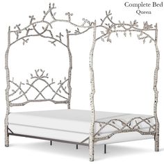 a white bed with branches on it and the words complete bed queen written in english