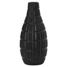 a black vase sitting on top of a white table