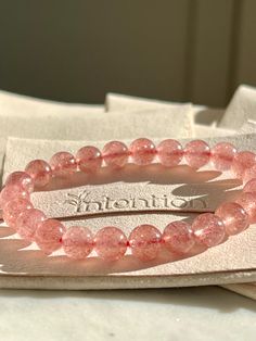 Strawberry Quartz Crystal Bracelet, Healing Crystal Jewelry, Gemstone Bracelet, Christmas Gift for Her, Women Bracelet, Love Crystal  💕Product Description💕 Each bead is a touchstone for courage, confidence, and clarity. Handmade with love in the USA, this bracelet is more than just jewelry; it's a daily reminder of your inner strength. Size: 8mm (one size fits all) Benefit: to increase self love and personal charm By wearing this crystal bracelet: you are setting your intention for the day! - Pink Rose Quartz Bracelets For Valentine's Day, Elegant Heart-shaped Crystal Bracelet For Valentine's Day, Valentine's Day Pink Rose Quartz Bracelets, Pink Rose Quartz Spiritual Bracelet, Elegant Hand-strung Rose Quartz Crystal Bracelet, Healing Crystal Jewelry, Strawberry Quartz, Christmas Gifts For Her, Gemstone Bracelet