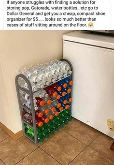 a rack full of empty water bottles next to a refrigerator