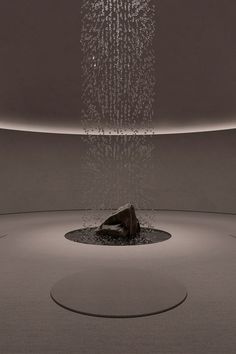 an artistic sculpture with lots of water coming out of it