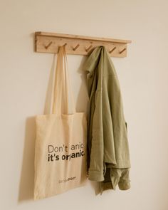 two totes hanging on a wall with the words don't and it's organic