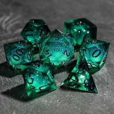 five green dices with black numbers on them