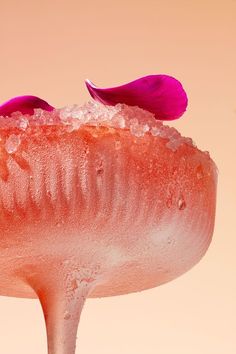 a mushroom with pink flowers on top of it