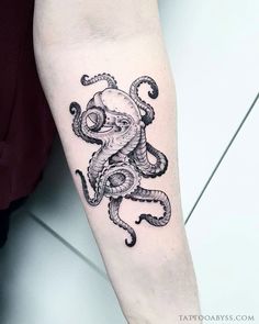 an octopus tattoo on the arm