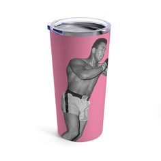 a pink tumbler with a black and white photo of a man holding a tennis racquet