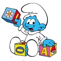 the smurf is sitting on top of blocks and holding a box with letters