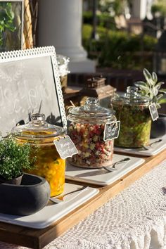 jars filled with food sitting on top of a table