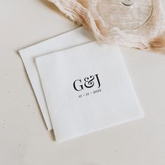 two napkins sitting on top of a white table