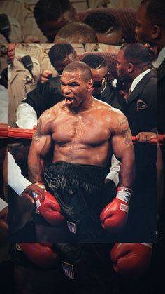 a man with red boxing gloves standing next to each other