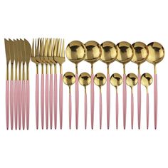 gold and pink forks, spoons and knives are arranged in a row on a white background