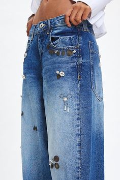 The ultimate pair of effortless boyfriend jeans from BDG updated with embellishments. Super relaxed and baggy fit throughout with a low-rise and a wide-leg silhouette. Made using recycled materials and finished with a BDG logo at the back pocket. Find it exclusively at Urban Outfitters. Features BDG Jaya embellished baggy boyfriend jeans Extreme baggy jeans Crafted from rigid BDG denim with embellishments Low rise that sits at the hip Full length with a puddled hem Zip fly; 5-pocket styling UO e Baggy Boyfriend Jeans, Jean Crafts, Elevated Basics, Boyfriend Jean, Baggy Jeans, Baggy Fits, Exclusive Collection, Recycled Cotton, Recycled Materials