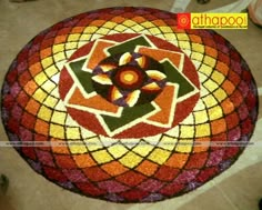 a colorful flower design is on the floor