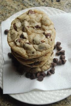 a stack of cookies and chocolate chips on a plate