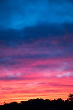 the sky is red and blue as it appears to be very colorful at sunset or dawn