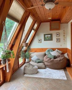 a living room filled with furniture and lots of windows