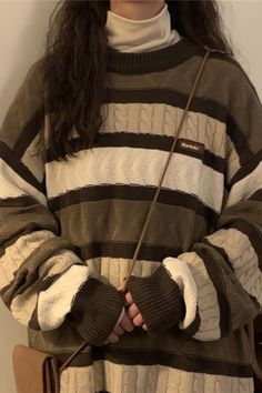 This vintage-style sweater has a brown knit construction, a striped design and long sleeves Cute Brown Clothes, Yellow Sweater Aesthetic, Thrift Ideas Clothes, Cute Knitted Sweaters, Brown Clothes Aesthetic, Brown And White Outfit, Thrifting Outfits, Brown Knitted Sweater, Nice Sweaters