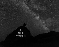 a man sitting on top of a mountain under the stars with text that reads i need my space