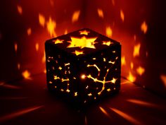 a lit up cube with stars on it