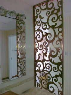 a bathroom with a sink and mirror next to a wall mounted shower headboard in the corner