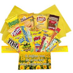 sunflowers and snacks in a yellow gift box