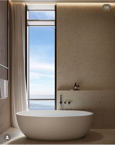 a large white bath tub sitting next to a window