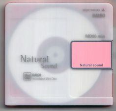 a close up of a cd with a pink label on it