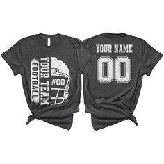 two t - shirts that say your name and football helmet on the front, one is black