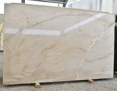 a large marble slab sitting on the ground