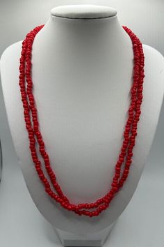 Red Coral Beaded Continuous Necklace Red Double Strand Beaded Necklaces, Red Double Strand Beaded Necklace With Faceted Beads, Red Double Strand Faceted Beaded Necklaces, Red Double Strand Faceted Beaded Necklace, Red Double Strand Beaded Chain Jewelry, Red Double Strand Beaded Necklace With Polished Beads, Handmade Multi-strand Red Beads, Handmade Red Multi-strand Beads, Adjustable Single Strand Red Beads