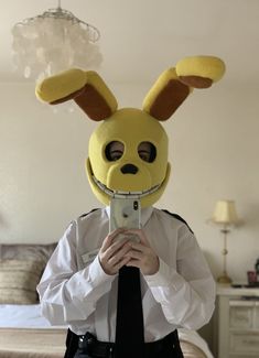 a person wearing a bunny mask taking a selfie