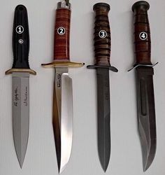 five different types of knives are lined up in a row on a white surface,