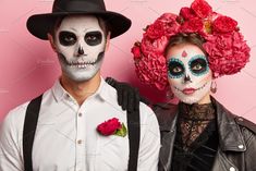 man and woman in day of the dead makeup