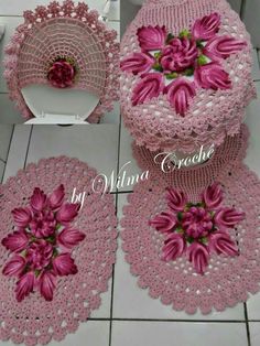 pink crocheted doily with flowers on it and two round doilies next to each other