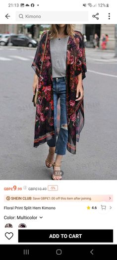 a woman walking down the street with her handbag in her pocket and wearing an oversize kimono