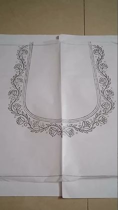 two sheets of paper with designs on them