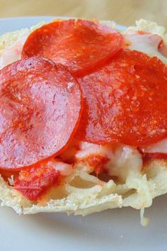 a pepperoni and cheese sandwich is on a plate