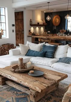 a living room filled with lots of furniture and decor on top of a wooden table