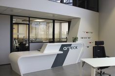 an office with white desks and black chairs in front of the window that reads arcck