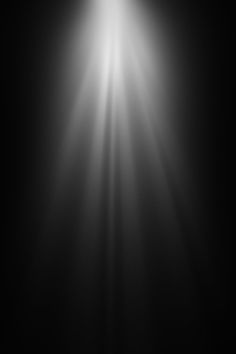 the light shines brightly through the dark sky in this black and white photo, which appears to be very bright