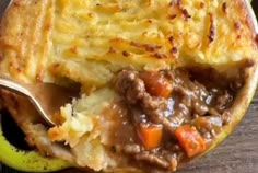 a close up of food on a plate with a spoon