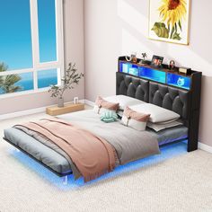 a bedroom with a bed that is lit up and has a sunflower on the headboard