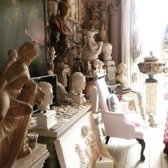 a room filled with lots of different types of statues